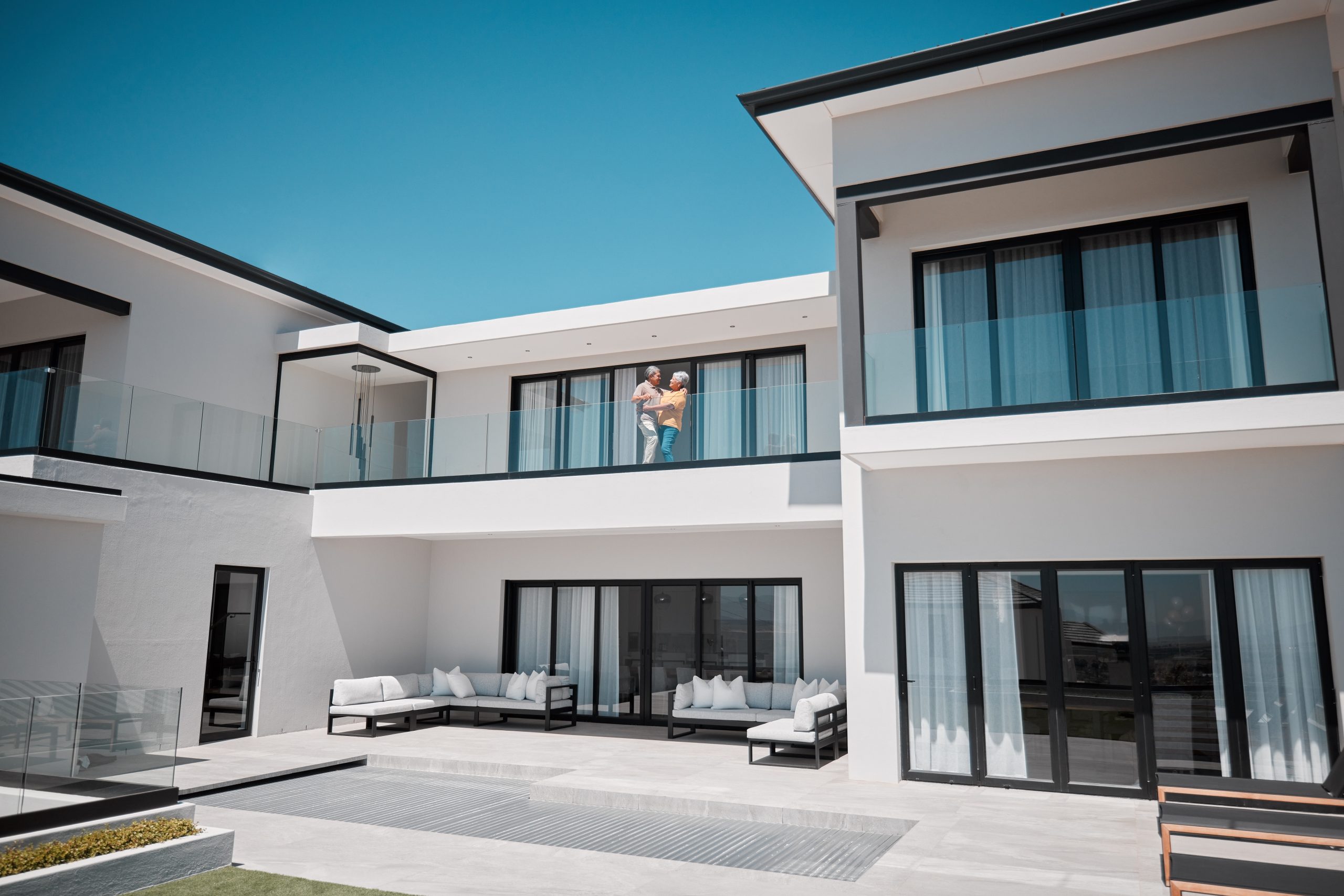 senior couple in luxury beach estate