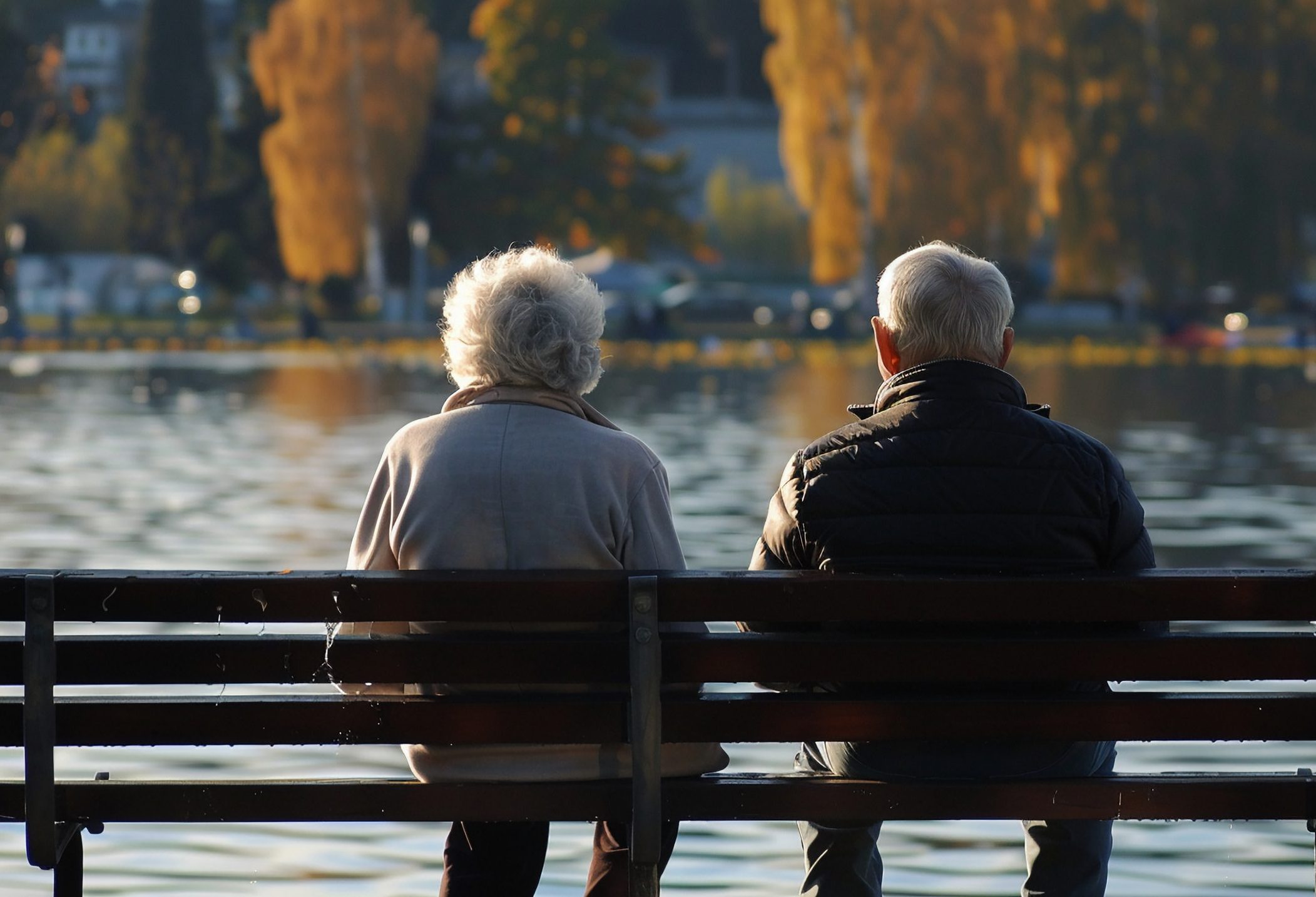 retired couple sitting on bench